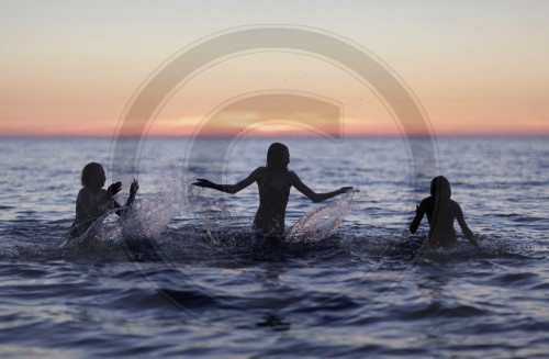 Children splashing in the Baltic Sea. Rerik, Germany. 04.06.2011. MODEL RELEASE available.