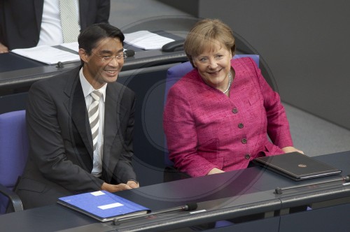 Angela Merkel, CDU, German Federal Chancellor and CDU chairwoman and Philip ROESLER, FDP, German Economics Minister and Vice Chancellor, on the government benches in the Bundestag. Berlin, 09.06.2011