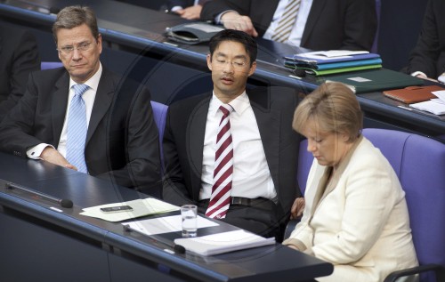 From the left to the right side: Guido WESTERWELLE, FDP, Federal Foreign Minister, Philipp ROESLER, FDP, German Economics Minister and Vice Chancellor and Angela MERKEL, German Federal Chancellor and CDU chairwoman in the Bundestag. Berlin, 10.06.2011.