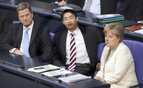 From the left to the right side: Guido WESTERWELLE, FDP, Federal Foreign Minister, Philipp ROESLER, FDP, German Economics Minister and Vice Chancellor and Angela MERKEL, German Federal Chancellor and CDU chairwoman in the Bundestag. Berlin, 10.06.2011.