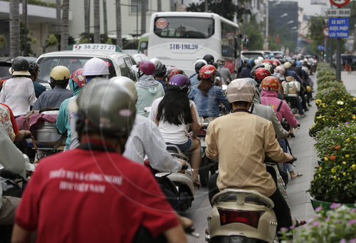 Rollerfahrer in Ho Chi Minh Stadt