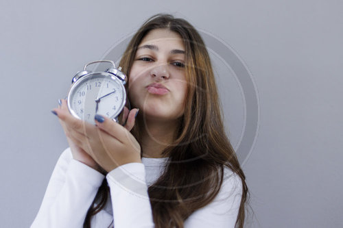 A girl with an oldschool clock