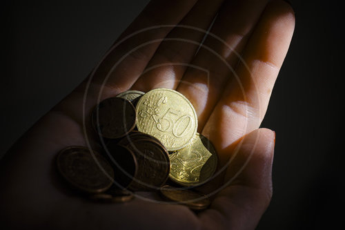 Kleingeld in der Hand